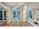 Light-filled foyer with hardwood floors and a view of the landscaped front yard at 1682 Hawthorne St, Sarasota, FL 34239