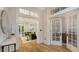 Hallway with wood floors leading to the living room and office space at 1682 Hawthorne St, Sarasota, FL 34239