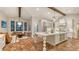 Open kitchen with white cabinetry, large island, and a cozy seating area with large windows at 1682 Hawthorne St, Sarasota, FL 34239