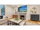 Living room featuring a fireplace, television, stylish décor, and comfortable sofa at 1682 Hawthorne St, Sarasota, FL 34239
