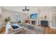 A living room featuring a fireplace with a television above, complemented by stylish decor and a comfortable sofa at 1682 Hawthorne St, Sarasota, FL 34239