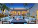 Charming outdoor patio with a fire pit, comfortable seating, water features and lush greenery, perfect for outdoor living at 1682 Hawthorne St, Sarasota, FL 34239