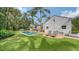 Picturesque backyard with a pool, lounge chairs, and lush greenery providing a serene oasis for relaxation and enjoyment at 1682 Hawthorne St, Sarasota, FL 34239