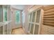 Walk-in closet features custom cabinets, windows, and hardwood floors at 1682 Hawthorne St, Sarasota, FL 34239