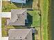 Aerial view of a house with fenced backyard and lake access at 17113 Reserva Dr, Bradenton, FL 34211