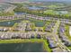 Aerial view of a community with houses, lakes, and a golf course at 17113 Reserva Dr, Bradenton, FL 34211