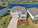 Beautiful two-story home boasts lush landscaping and a serene water view at 17113 Reserva Dr, Bradenton, FL 34211