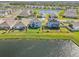 Aerial view of houses with fenced backyards and lake access at 17113 Reserva Dr, Bradenton, FL 34211