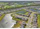 Aerial view of a large community with houses, lakes and golf course at 17113 Reserva Dr, Bradenton, FL 34211