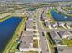 Aerial view of a neighborhood with houses near a lake at 17113 Reserva Dr, Bradenton, FL 34211