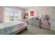This bedroom boasts a window for natural light and neutral-toned carpet at 17113 Reserva Dr, Bradenton, FL 34211