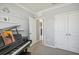 Bedroom with piano, double doors, and built-in shelving at 17113 Reserva Dr, Bradenton, FL 34211