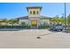 Community center exterior, featuring Spanish-style architecture and ample parking at 17113 Reserva Dr, Bradenton, FL 34211
