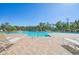 Inviting community pool with lounge chairs and shaded seating areas at 17113 Reserva Dr, Bradenton, FL 34211
