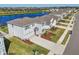Charming two-story home with landscaped yard, lake view, and a well-manicured lawn at 17113 Reserva Dr, Bradenton, FL 34211