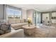 Open-concept living room flows into dining area, offering view and bright interior at 17113 Reserva Dr, Bradenton, FL 34211