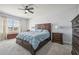 Main bedroom with large bed, nightstands, and dresser at 17113 Reserva Dr, Bradenton, FL 34211