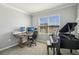 Bright office space with a piano, a large window, and ample workspace at 17113 Reserva Dr, Bradenton, FL 34211