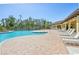 Expansive pool area with numerous lounge chairs surrounding the pool at 17113 Reserva Dr, Bradenton, FL 34211