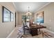 Bright dining room with wood table and artwork at 2467 Vaccaro Dr, Sarasota, FL 34231