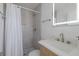 Clean bathroom with a walk-in shower and modern vanity at 303 65Th St # A, Holmes Beach, FL 34217