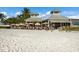 Beachfront restaurant with many customers at 303 65Th St # A, Holmes Beach, FL 34217