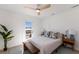 Bright bedroom with a queen bed and access to a private deck at 303 65Th St # A, Holmes Beach, FL 34217