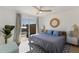 Main bedroom with a king bed and private balcony access at 303 65Th St # A, Holmes Beach, FL 34217