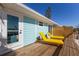 Private deck with yellow lounge chairs and a view at 303 65Th St # A, Holmes Beach, FL 34217