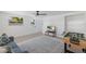 Fun game room with foosball table, comfortable seating, and a large TV at 303 65Th St # A, Holmes Beach, FL 34217