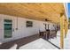 Covered patio with outdoor seating and ceiling fan at 303 65Th St # A, Holmes Beach, FL 34217