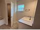 Bathroom featuring a white sink and a large window for natural light at 3325 Stockton Ave, North Port, FL 34286