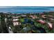 Aerial view of waterfront community with pool and lush landscaping at 3420 Wild Oak Bay Blvd # 118, Bradenton, FL 34210