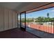 Balcony with sliding glass doors offering a view of neighborhood and palm trees at 3420 Wild Oak Bay Blvd # 118, Bradenton, FL 34210