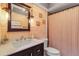 Charming bathroom with wood-paneled walls and updated vanity at 3420 Wild Oak Bay Blvd # 118, Bradenton, FL 34210