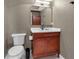 Updated bathroom features a vanity with a white countertop, and a toilet at 3420 Wild Oak Bay Blvd # 118, Bradenton, FL 34210