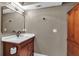 A modern bathroom with a white countertop vanity and wooden cabinet at 3420 Wild Oak Bay Blvd # 118, Bradenton, FL 34210