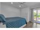 Bright bedroom with a comfortable bed, and access to a balcony at 3420 Wild Oak Bay Blvd # 118, Bradenton, FL 34210