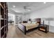 Spacious bedroom with hardwood floors, large closet, and built-in bookcases at 3420 Wild Oak Bay Blvd # 118, Bradenton, FL 34210