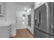 Sleek kitchen with stainless steel refrigerator, white cabinets, and hardwood floors at 3420 Wild Oak Bay Blvd # 118, Bradenton, FL 34210