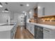 Modern kitchen featuring white cabinets, quartz countertops, and stainless steel appliances at 3420 Wild Oak Bay Blvd # 118, Bradenton, FL 34210