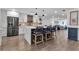 Modern kitchen with white cabinets, large island, and stainless steel appliances at 3420 Wild Oak Bay Blvd # 118, Bradenton, FL 34210