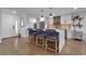 Modern kitchen with white cabinets, large island, and stainless steel appliances at 3420 Wild Oak Bay Blvd # 118, Bradenton, FL 34210
