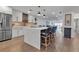 Modern kitchen with white cabinets, large island, and stainless steel appliances at 3420 Wild Oak Bay Blvd # 118, Bradenton, FL 34210