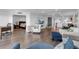 Open living space with hardwood floors, and views into the bedroom and kitchen at 3420 Wild Oak Bay Blvd # 118, Bradenton, FL 34210