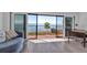 Stunning water view from a condo living room with sliding glass doors to balcony at 3420 Wild Oak Bay Blvd # 118, Bradenton, FL 34210