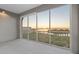 Screened balcony with sunset views over the water at 392 Aruba Cir # 403, Bradenton, FL 34209