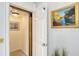 Residential elevator featuring paneled walls, brass accents and an internal ceiling light at 3927 Somerset Dr, Sarasota, FL 34242