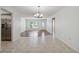 Bright dining room features tile floors and a chandelier at 4301 Teakwood Cir, Bradenton, FL 34208