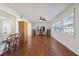 Bright living room features hardwood floors, a large TV, and built-in shelving at 4301 Teakwood Cir, Bradenton, FL 34208